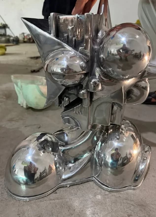 Piece 8 — original sculpture design by Yael Matute, carved by Nelson Ngonisa, reproduced in aluminum by Crayon Artel without designer credit